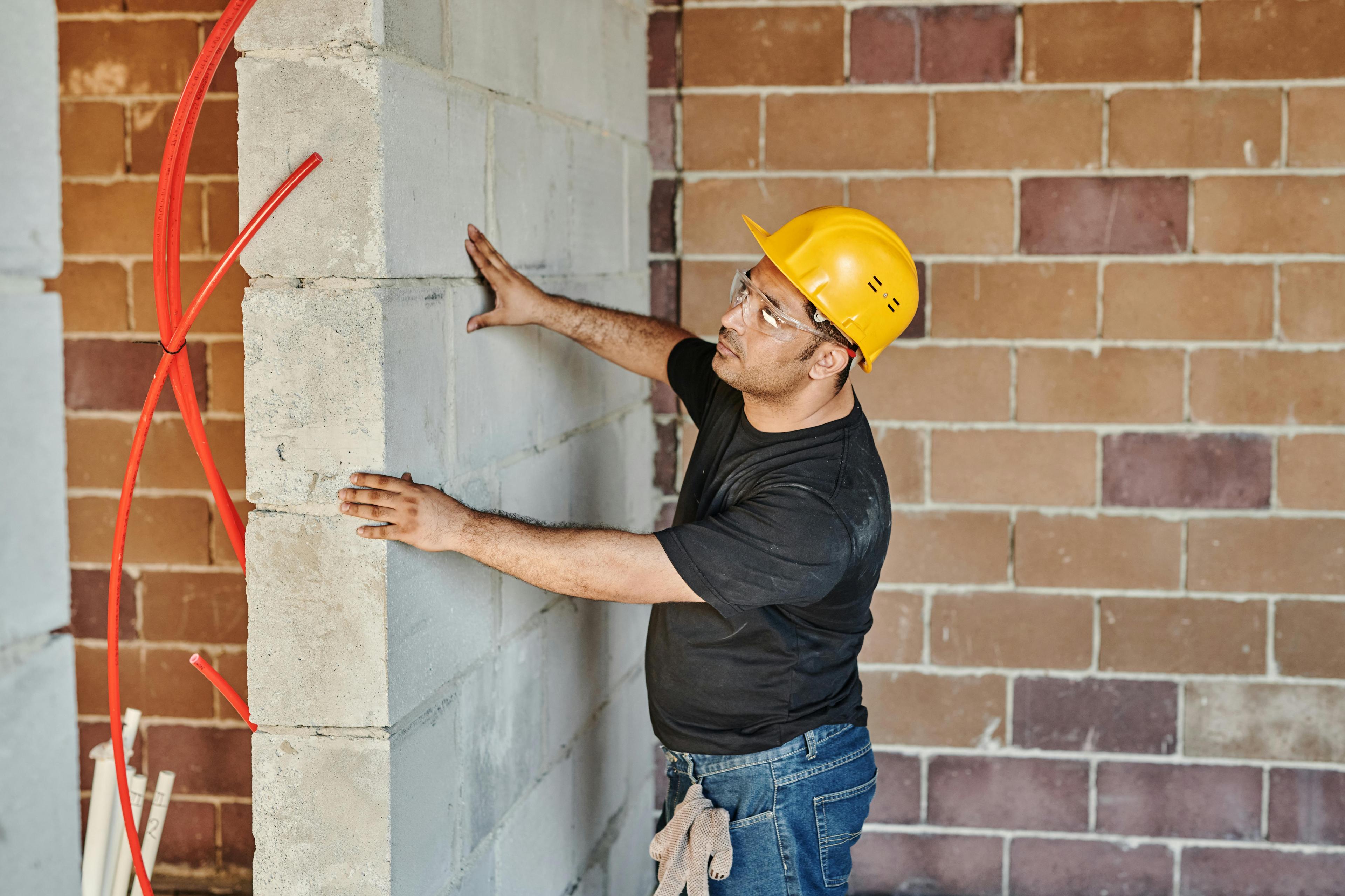 worker applying bricks