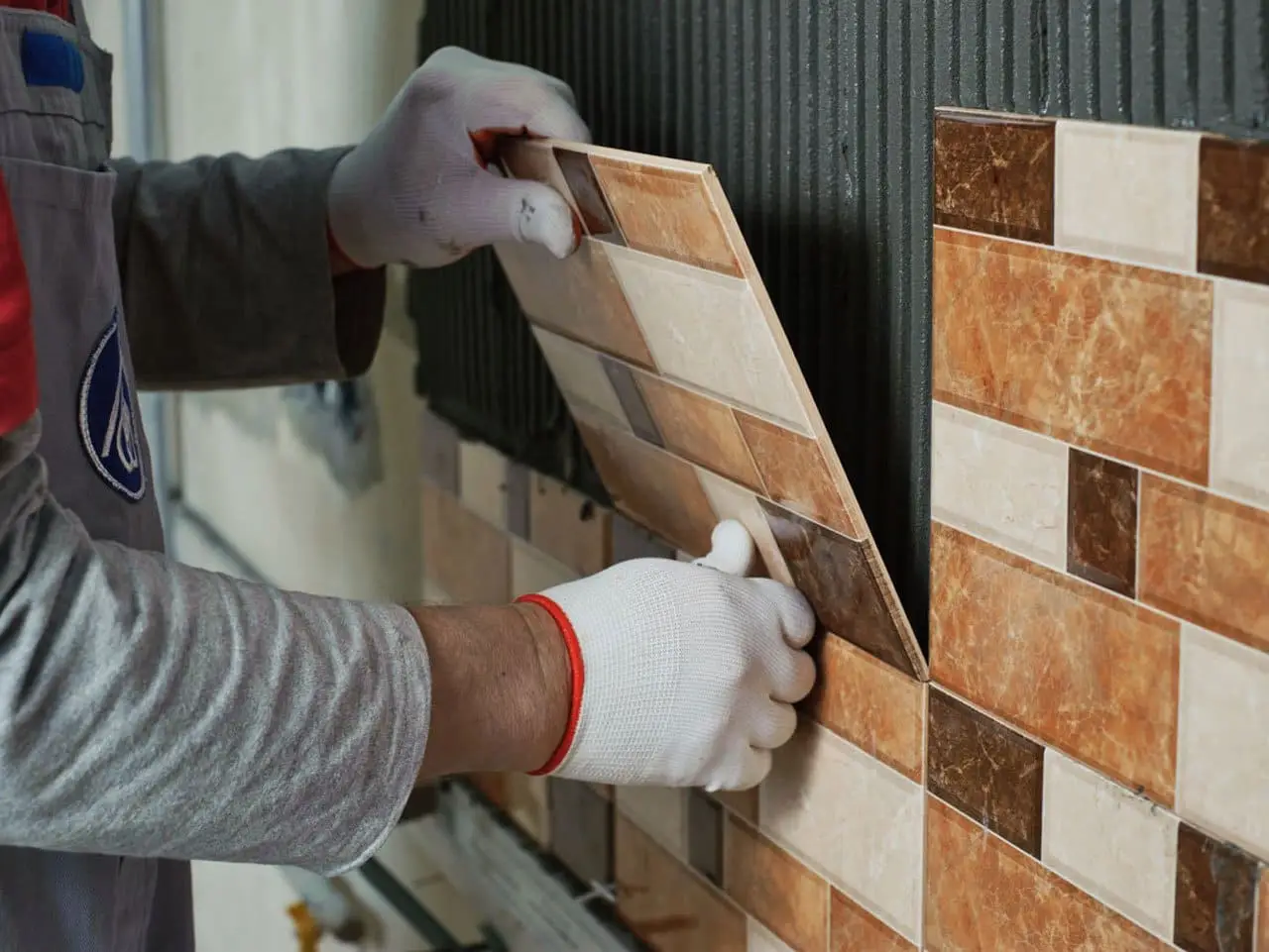 New ceramic wall tiles being installed by Little Rainy Construction in Brantford, Ontario, Canada