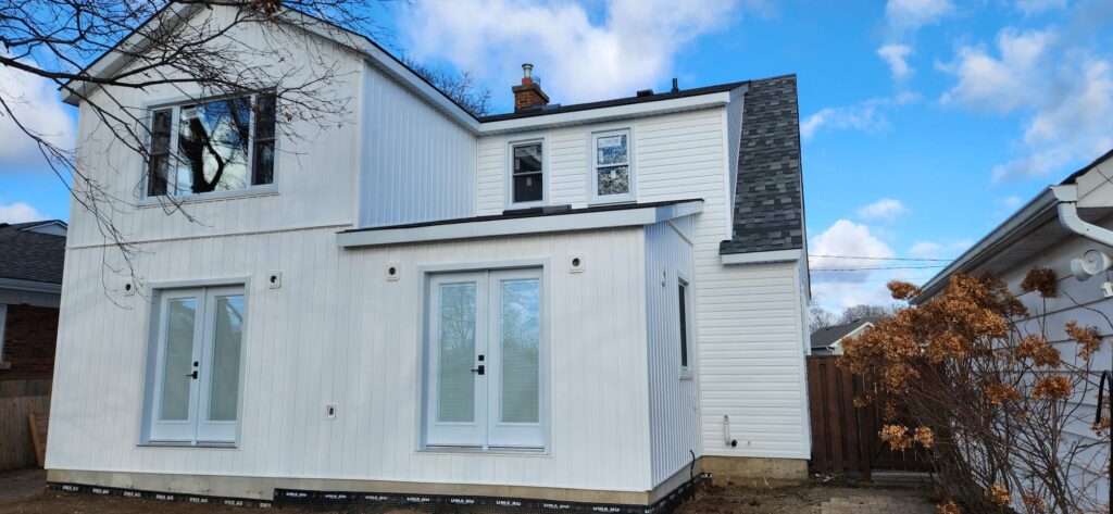 Additional Dwelling Unit build onto the back of a white house by LRC Construction