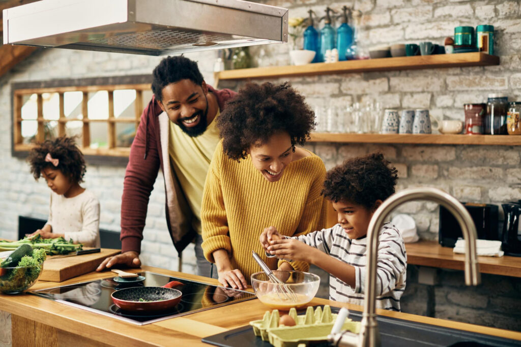 happy family cooking together in their kitchen